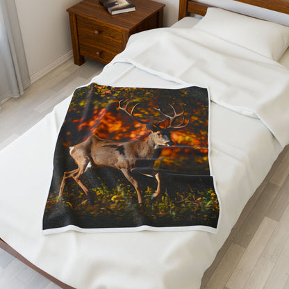 Hunting blanket featuring a deer with antlers walking through the woods
