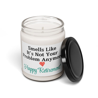 "Smells Like It’s Not Your Problem Anymore" candle displayed on a coffee table.
