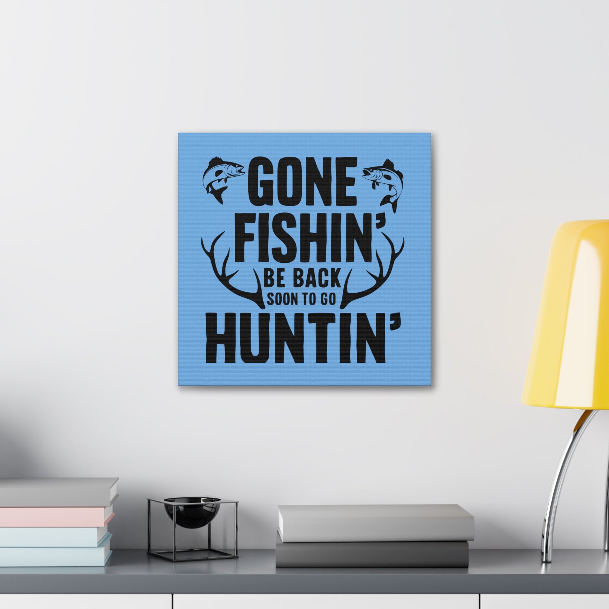 Hunting and fishing wall art with blue background
