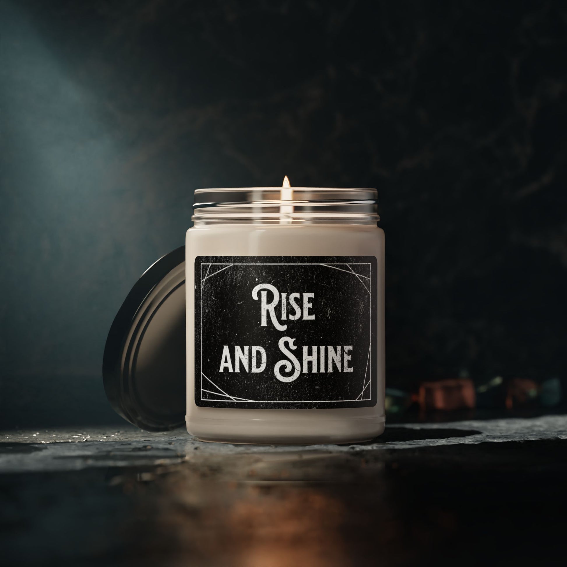 Uplifting candle with “Rise and Shine” in white text
