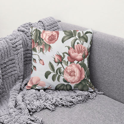 Pink floral pillow with soft pink roses and white background
