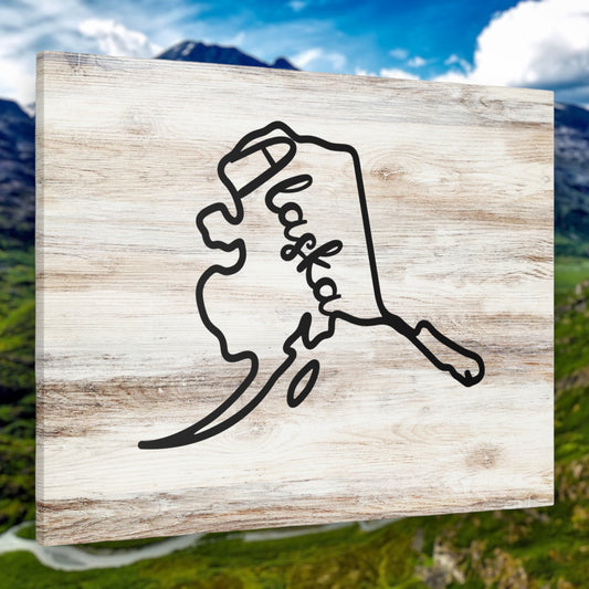 Rustic Alaska state outline wall art on wooden background
