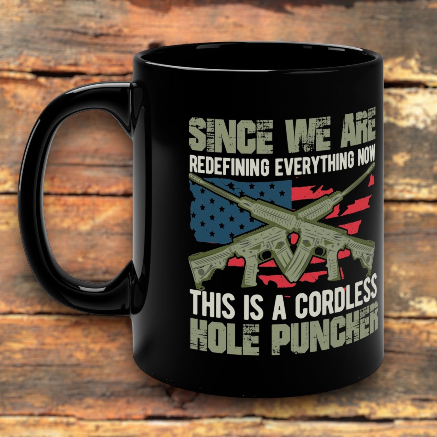 2nd Amendment coffee mug with “Cordless Hole Puncher” text and rifles.
