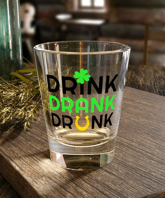 Irish-themed shot glass with "Drink, Drank, Drunk"
